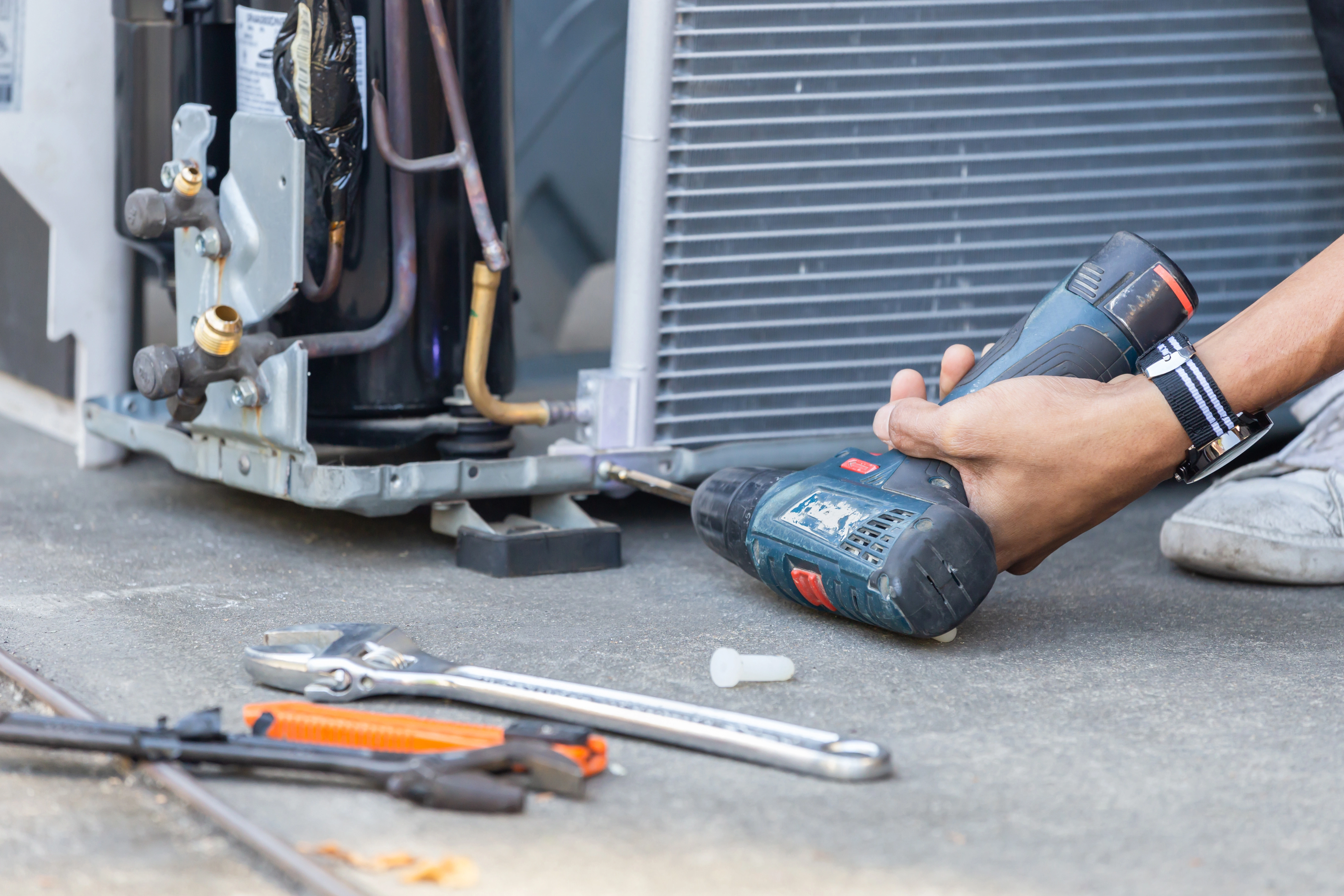 An Jarvis HVAC technician performing HVAC services in Milton, MA.